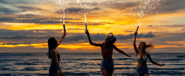 group of girls holding sprinklers